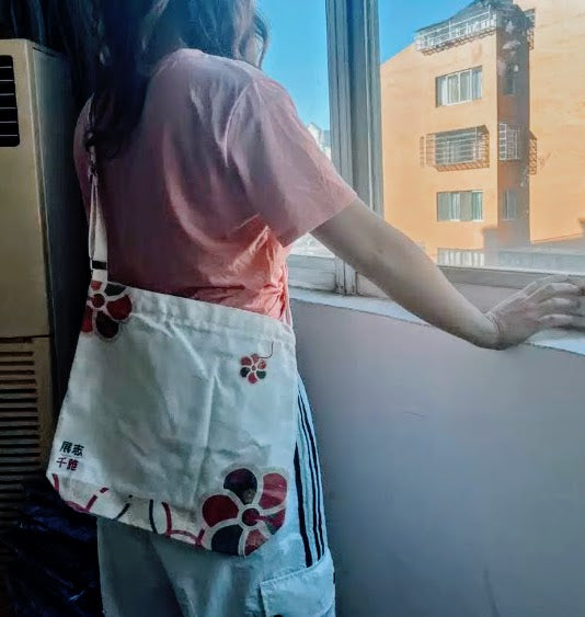Pebbles Pengu cross-body canvas bag